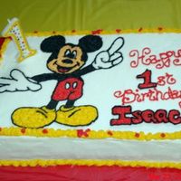 Mickey Mouse Birthday Cake I'm a newbie at decorating cakes but I wanted to do my baby's 1st birthday cake. This is the result after getting lots of help...