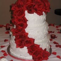 022.jpg this is my first tiered cake i made for a coworker