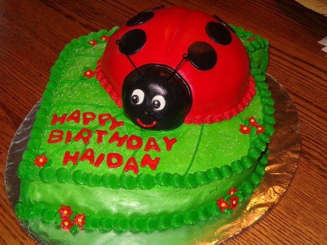 Ladybug Birthday Buttercream leaf, fondant covered ladybug.