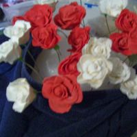 Bouquet.jpg Rose and white gumpaste roses made for a friend who was ill to help cheer her up. There were arranged in floral foam and a cobalt blue vase...