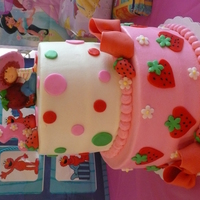 Strawberry Shortcake 8"/6" BC w/MMF. Gumpaste bows, three, and strawberries. Design on tiers based on springlakecake's strawberry shortcake cake...