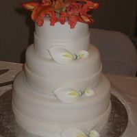 Calla Lilly Wedding Cake Believe it or not this is my first wedding cake. It is a rum soaked vanilla cake, with rum butter creme. I made the Calla Lillies and the...