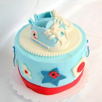 Top Cake With Baby Chucks For my friend's baby shower. Sat on top of the cupcake tower.