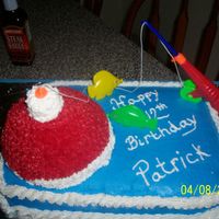 Bobber Cake One of my fist cakes for a friend. Her son wanted a bobber cake. Used the ball cake pan. Looked like santas hat , so I added the pole and a...