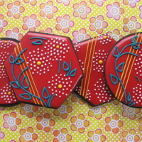 Red Lacquer Chinese Floral Cookies Inspired by chinese red lacquer floral prints. Glace icing on dark chocolate cookies. Featured in the August issue of Cake Central Magazine...