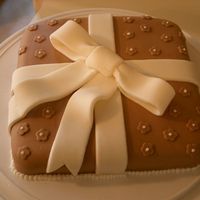 Present Cake My first fondant cake done for Wilton Course III. It is a chocolate mint cake covered in chocolate and mint MMF.