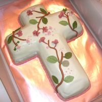 Cross With Flowers Vanilla cake with buttercream filling covered in mmf. All decorations are fondant. I had a great time making this one for a friend whose...