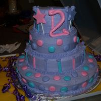 Abby Cadabby Cake Cream cheese icing with candy mold accents...this was fun to do for my very first stacked cake. It was wobbely...still trying to master the...