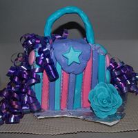 Purse Cake For A 2 Year Old Cream cheese icing with candy mold accents