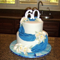 60Th Anniversary Cake Lemon wasc with lemon mousse swirled with lemon curd....how lemony! Fondant with gumpaste accents.