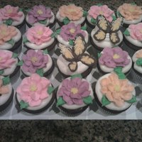 Springtime Cupcakes WASC chocolate cupcakes with rum custard filling, buttercream icing and chocolate butterflies.