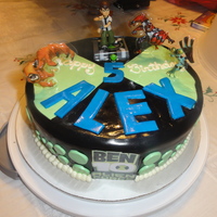 Ben 10 basic yellow cake with buttercream frosting covered in fondant. The client bought the toys to go on the top of the cake