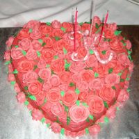 Birthday Cake Covered In Roses This is a strawberry cake that I made for my best friends birthday. The cake is strawberry cake with buttercream icing. It was a big hit.