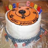 Fil's Birthday Cake design adapted from bellsinstoke. alternating layers of yellow butter cake and chocolate, fondant target, my buttercream, fondant pearl...