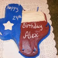 L_4E7A5Cfeed4044F38E43Ce372F8A.jpg this is my brother's birthday cake. basic yellow cake, my buttercream, carved into its proper shape by my wonderfully artistic husband...