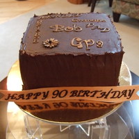 Bob's 90Th Birthday Suprise Cake 8 inch square German chocolate cake. Used all the names Bob is known as for decorations on the top. Kept it very dignified and simple.