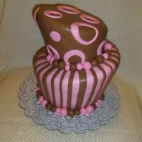 Topsy Turvy Top tier chocolate+white cake, bottom chocolate+mocha cake. Raspberry+hazelnut filling. Covered with MMF and chocolate MMF. No support (wow...