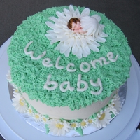 Daisy Baby Coconut cake with pineapple and coconut filling. Buttercream icing, fondants accents.