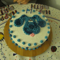 Blue's Clues I made a 2-layer cake covered in buttercream. Traced a printout of Blue's head on top and filled in using a medium star tip.