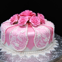 Roses And Lace This was a birthday cake for a lady named Rose. Covered in fondant with gumpaste roses and lace overlay.