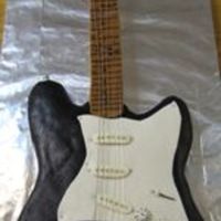 Birthday Request Our first ever fondant cake! Exact replica of the real guitar. Every knob, button, decoration was carefully measured and created. We even...
