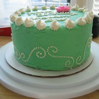 First Cake Side View The side view of my first cake. I used the Wilton designer pattern press set scroll piece for the side.