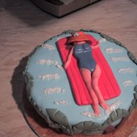 Img_0072.jpg A suprise cake for my sun loving best mate, unfortunately i had problems with her legs!!!