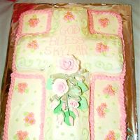 My Daughter's Christening Cake Sheet cake is vanilla and cross is chocolate. Butter cream frosting with gum paste flower topper.