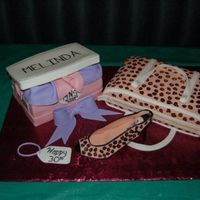 Purse, Shoe, & Shoebox Cake First time using fondant. Made this for my sister-in-law. Everyone at the party loved it.