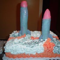 Missile Cake This cake was made for a friend who is an engineer and works on missiles. Missiles are rice crispy treats, fins are gumpaste, and smoke and...