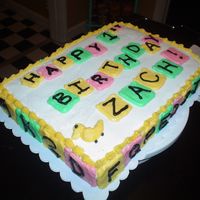 Baby Block Cake This is a one layer 9x13 chocolate cake with buttercream frosting.