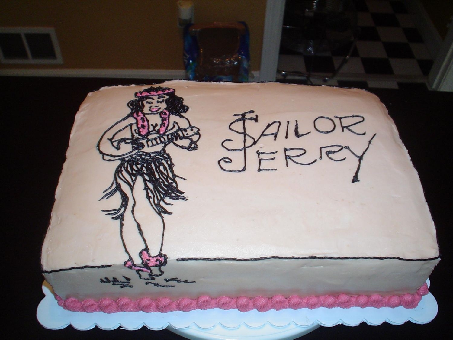 Sailor Jerry Rum Cake White cake with rum flavoring, buttercream icing. Since it was rum flavored, I figured I'd do a Sailor Jerry themed cake. This was my...