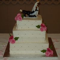 Shelley's Wedding White and chocolate cake, ivory buttercreme icing, gumpaste roses colored with rose and grapefruit petal dust. This cake just about got the...