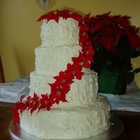 Nichols Wedding Christmas Wedding Cake. First and third layers are white cake, other two are chocolate cake, cream cheese icing.