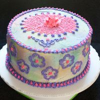 Flowercake.jpg This is all buttercream. Use the spray colors and sprayed all over.