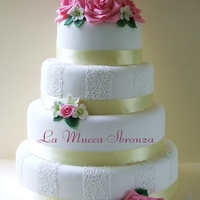 Pink Rose Wedding Cake rich chocolate cake filled with chocolae mousse , pistacchio mousse and orange curd.