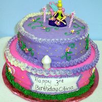Tinkerbell Tink cake buttercream with gumpaste mushrooms and flowers. mom brought the topper