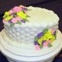 Basket Cake This was my finale cake for Wilton Cake Decorating Course 2. Royal Icing flowers...the rest is Buttercream Icing.