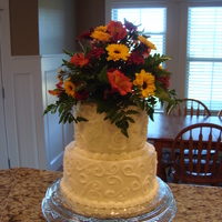 Anniversary Cake I made this for my parent's 39th anniversary this year. The flowers are a little big, but you should have seen them before I trimmed...