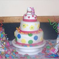 Hello Kitty Cake This was my first tier cake ever.... was a little difficult to fondant the small cake but I made it. Cake was all Yellow but filled with,...