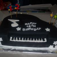 Piano Cake Yellow with vanilla buttercream, birthday boy plays piano