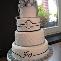 White Wedding Cake With Silver And Black Accents White wedding cake with silver and black accents. For the record....JA (bottom tire) means YES in Dutch :-)