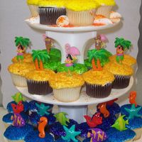 Summer Time 36 cupcakes each tier has differnce summer items , under the sea, aloha theme, and grilling party