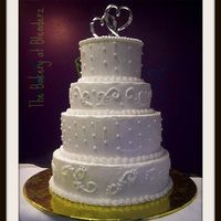 Wedding Dummy Dummy 12,10,8 & 6" rounds with BC. I covered the board in a gold foil not knowing that the only cake topper I would find would be...