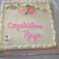 Bridal Shower Carrot cake with Crusting Cream Cheese Frosting. Flowers are MFF/RBC mixture, and wedding couple sugar lay-on.