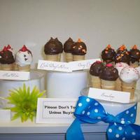 Cake Ball Truffles Various flavors of cake ball truffles in ice cream cones.