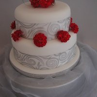 2 Tier Carnations 8inch sponge and 6 inch round fruit cake with handmade carnations