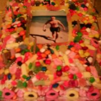 Candy Picture Frame Cake made for friends son. recipe/idea from australian womans weekly.laminated photo in centre. jam (jelly?) filled and covered with buttercream...