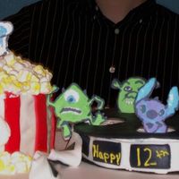 Popcorn And Movie Reel This is my 2nd cake. It was for my son's 12th b-day. The whole thing is covered in mmf and the characters are royal icing transfers....