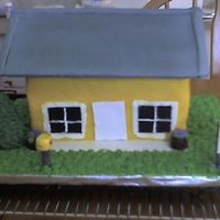 House Cake Cake is (2) 9x13 cut in half, buttercream. Roof is cardboard covered in fondant, and placed on top. All other misc items, tree, mailbox,...